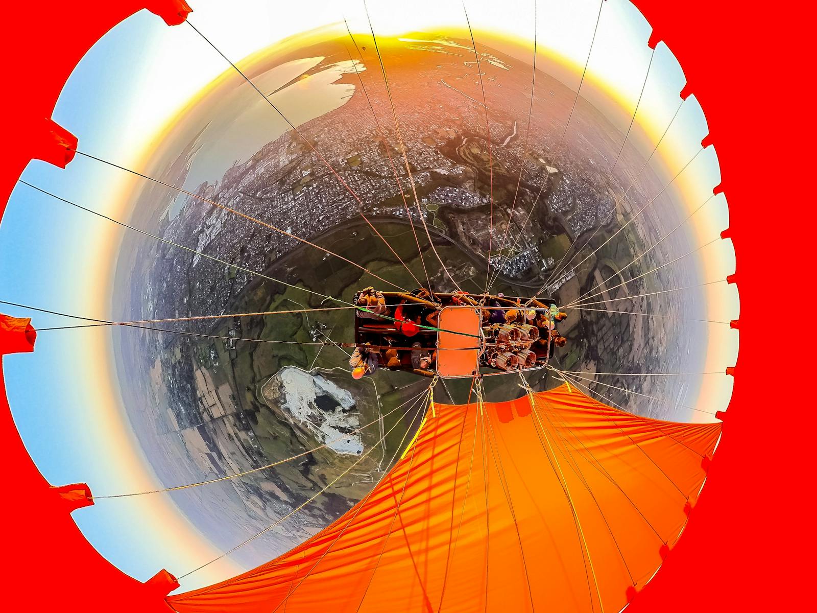 image taken looking down into the basket from the view of the balloon