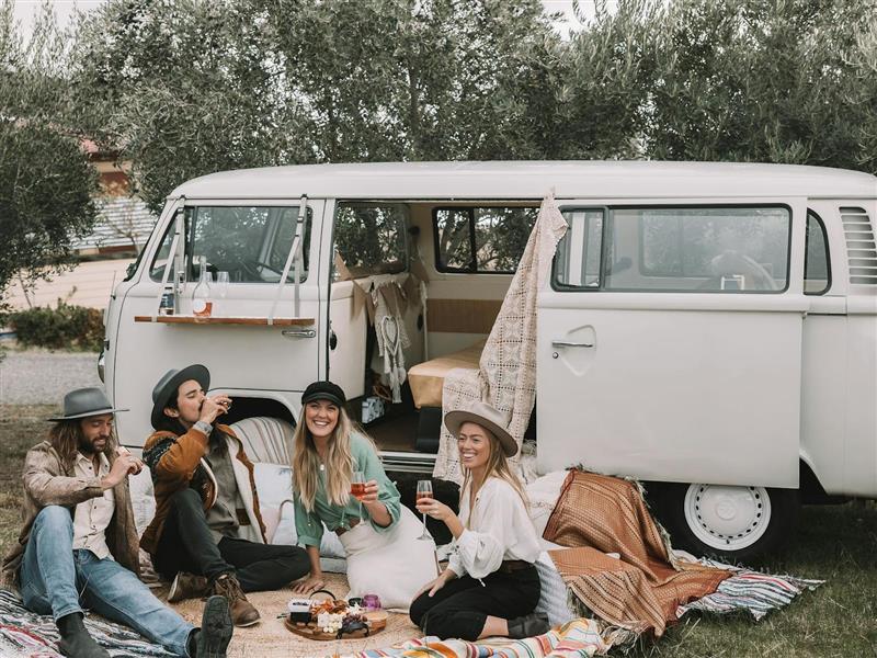 Guests enjoying wine and grazing platter by the kombi in Rutherglen