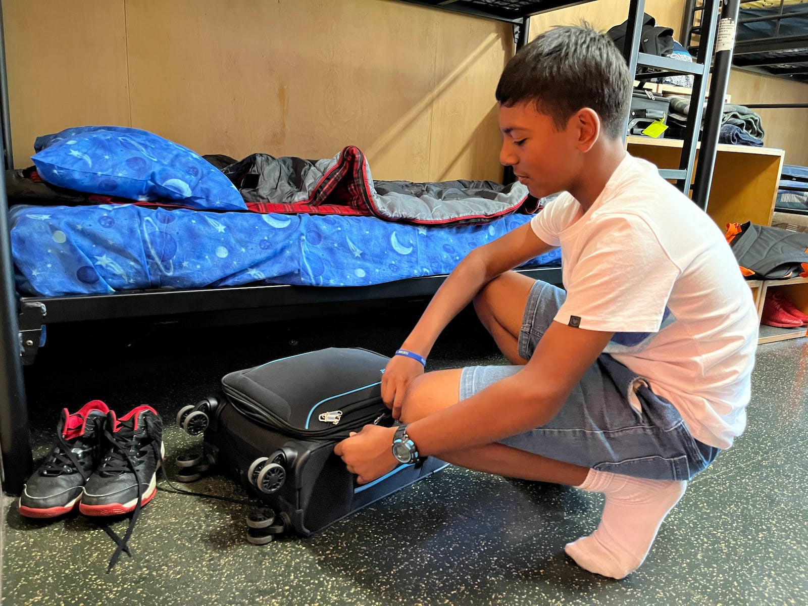 Student unpacking a case at Urban Camp