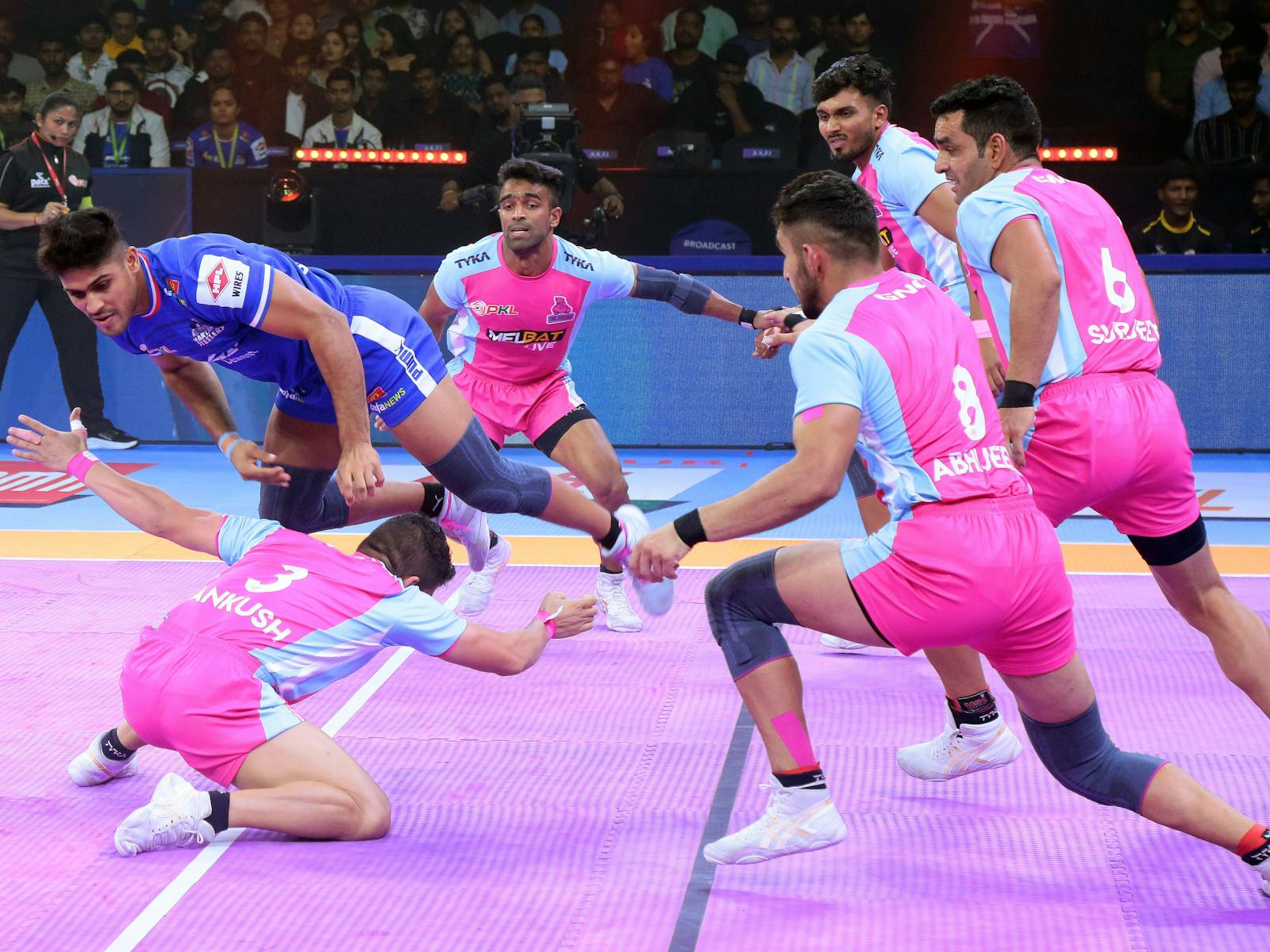 Kabaddi players in the air