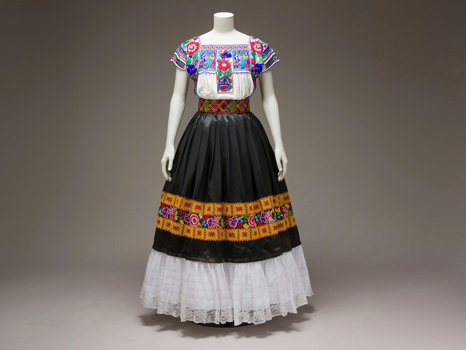 Cotton blouse embroidered with glass beads; satin skirt with chain stitch and floral motif embroider