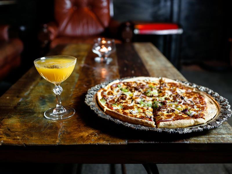 Order a Pizza from Crust upstairs from us