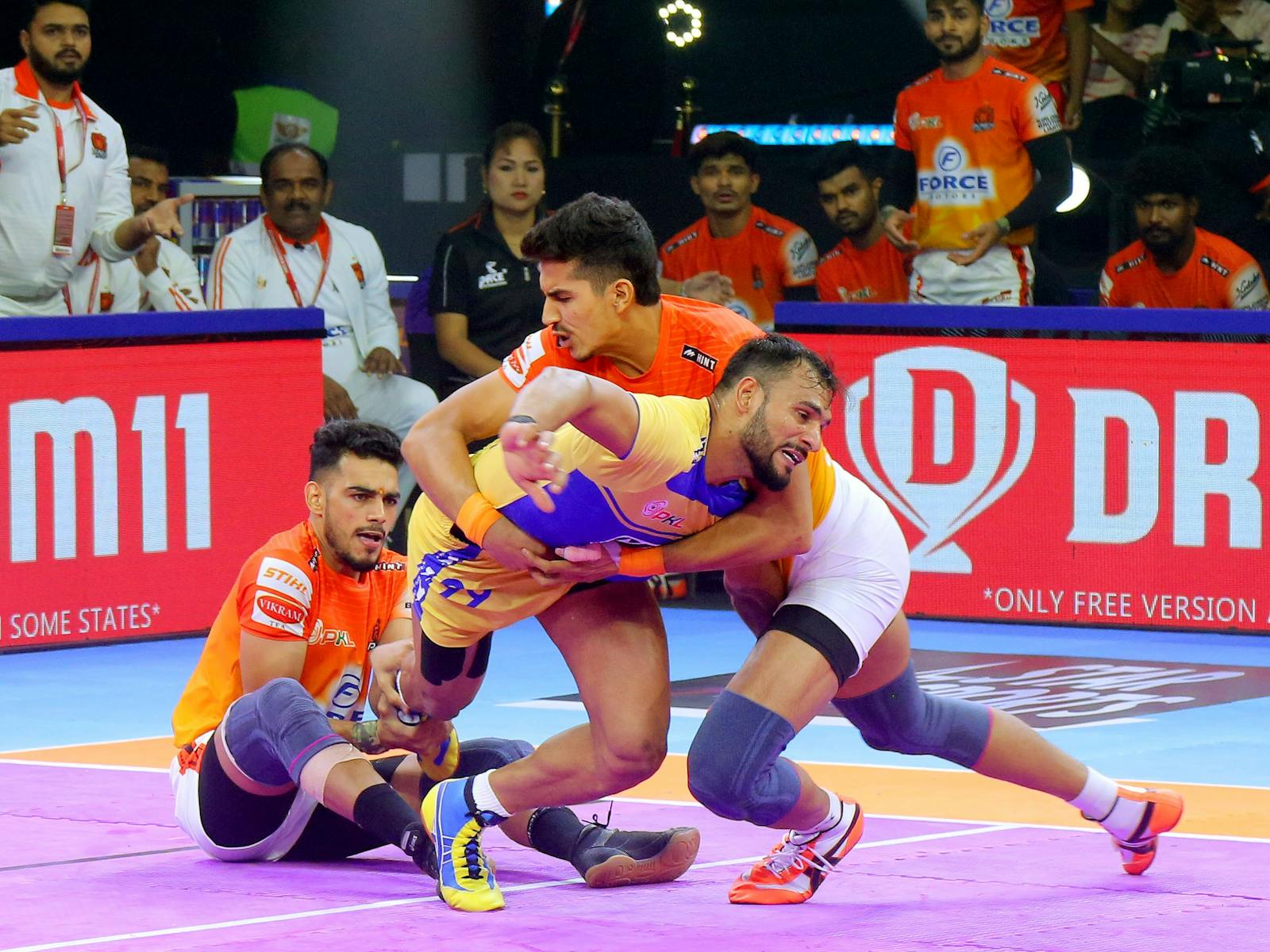Kabaddi players wrestling
