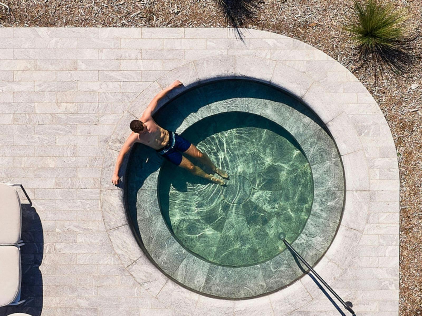 Man bathing in geo thermal pool